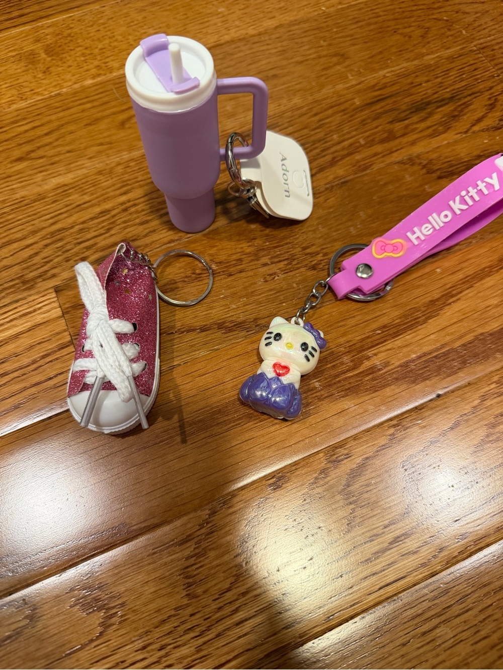 Hello Kitty Pink Wrist Strap with Purple-accented Kitty Charm